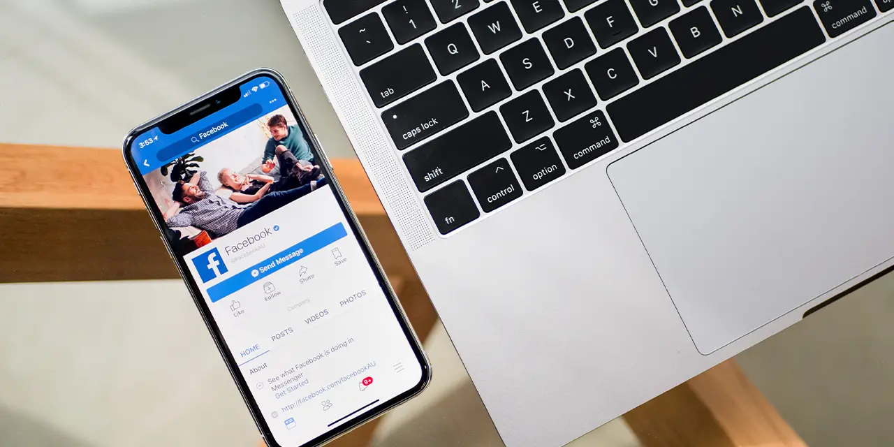 Facebook user logging into the social network to share their digital business card