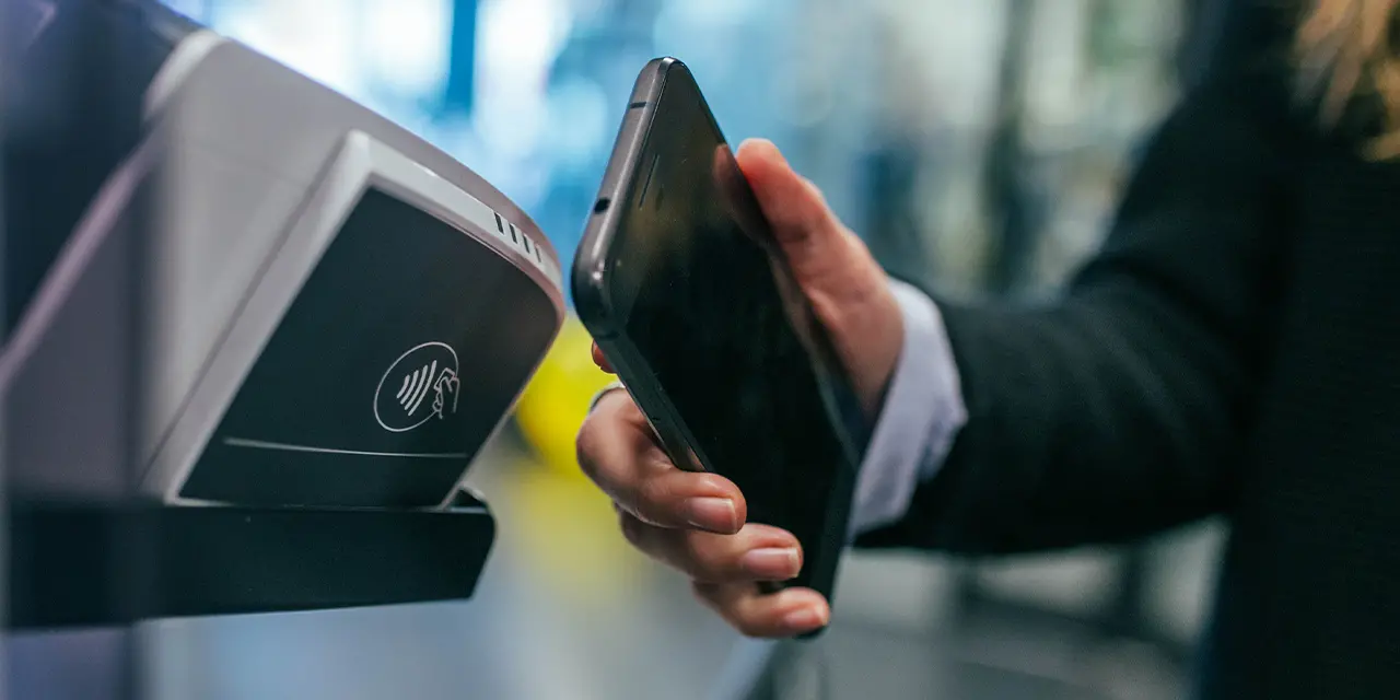 Person using NFC technology for payment